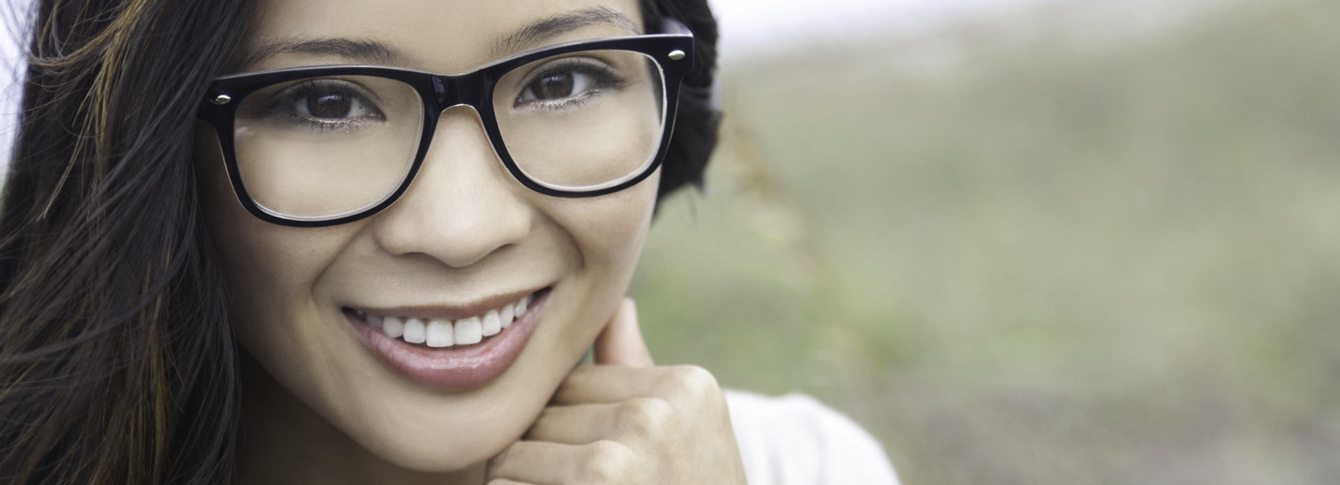 cheerful woman in glasses