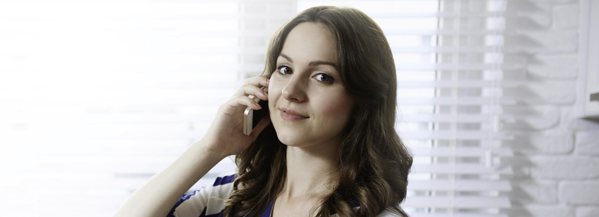 cheerful woman with cellphone