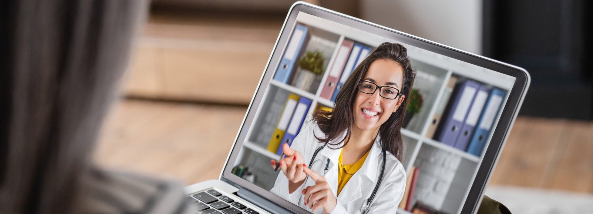 woman having a video call with doctor