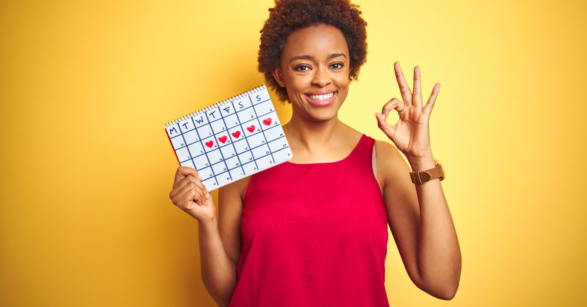 Smiling woman holding a calendar